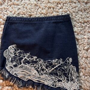 Black Mini Skirt with White Embroidered Detail and Fringe